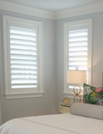 White plantation shutters with hidden tilt rods in Chicago